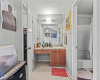 The primary bedroom provides a walk-in closet and its own private vanity area with access to the shared jack-n-jill bath. 