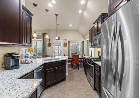 Kitchen with granite counters, stainless steel appliances