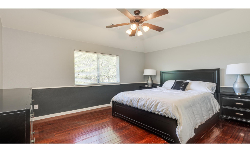 All of the secondary bedrooms feature tall ceilings, hardwood floors, ceiling fans, and excellent closet storage. 