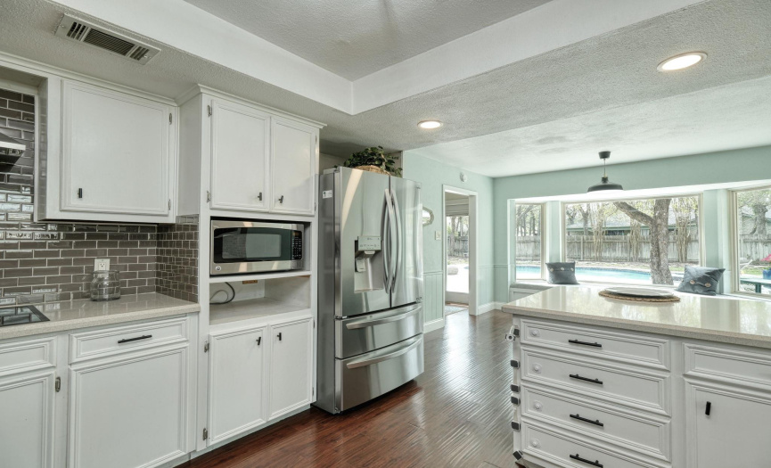 Large kitchen with plenty of counter space and stainless appliances.