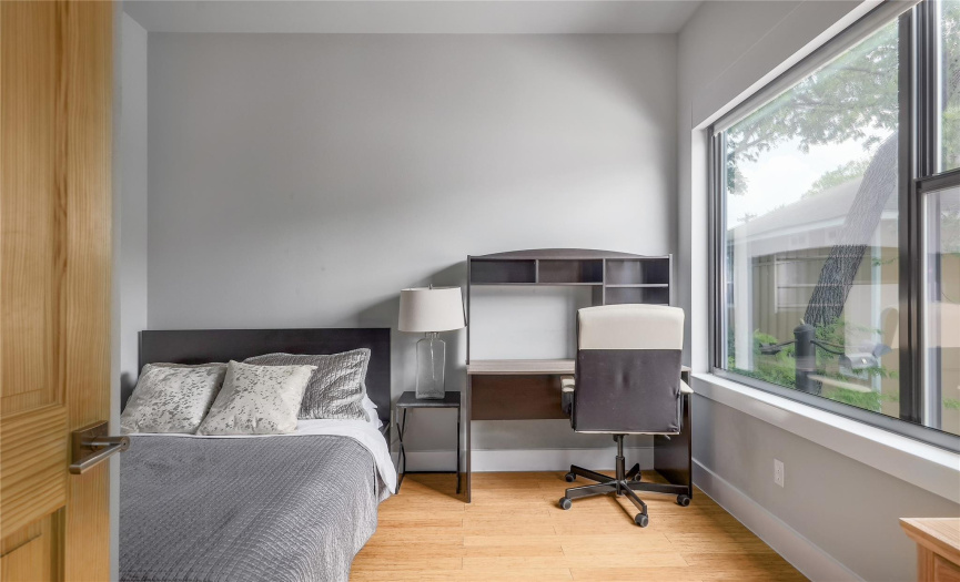 The third bedroom offers fantastic options for home office, workout space, or guest room.