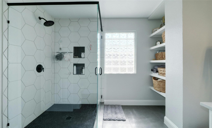 Indulge in the modern elegance of a glass-enclosed shower in the primary ensuite. This sleek and sophisticated feature adds a touch of luxury to your bathing experience.