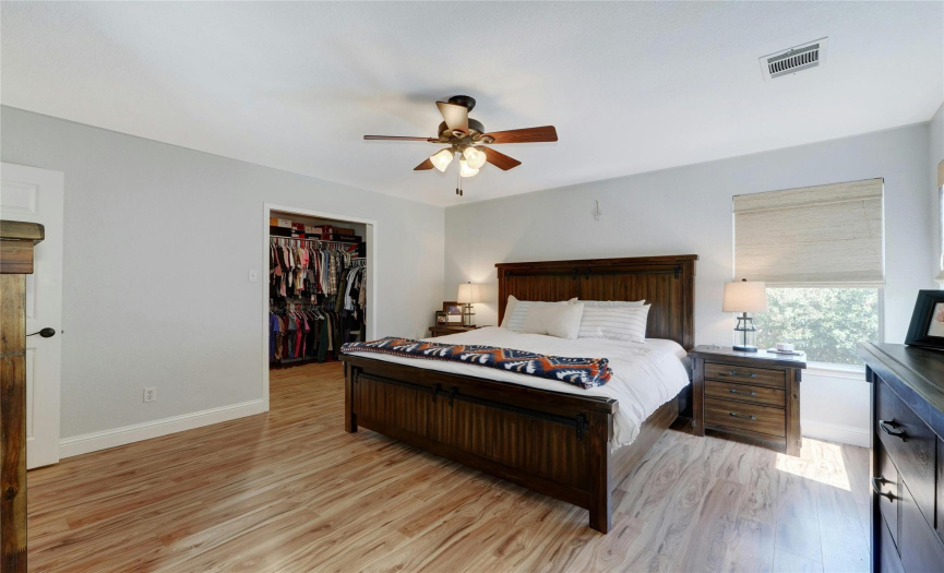 Experience the luxury of a huge walk-in primary closet, offering ample storage space and organizational possibilities.