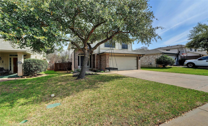 A majestic, large front tree graces the property, adding natural beauty and curb appeal.