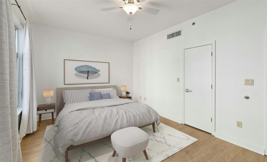 Virtually staged ~ primary bedroom w/ walk-in closet and private bath attached.