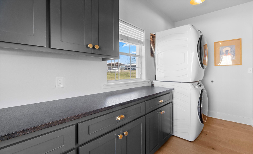 Laundry room with plenty of cabinet storage, counter space, and complete with a coffee nook and mudroom area