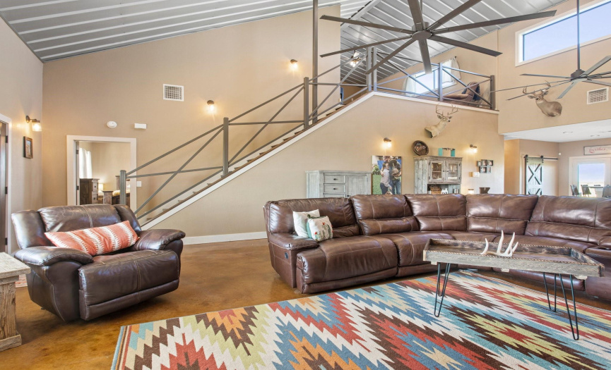 The open concept living area has vaulted ceilings.