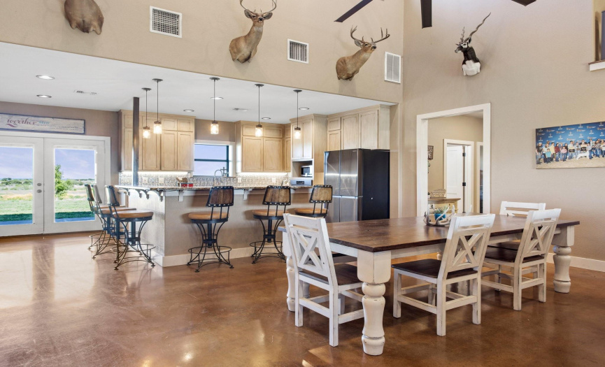 The kitchen and dining area are open to the living room and offer views from both the front and back of the home.  