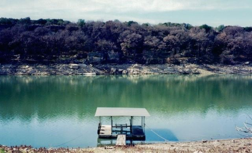 The Pedernales River in better days .... this IS the shoreline of 24805 Lake View Drive although the Boat Dock in the photo is no longer at the property.  New owners may want to add a new dock or swim platform built per their specific needs.