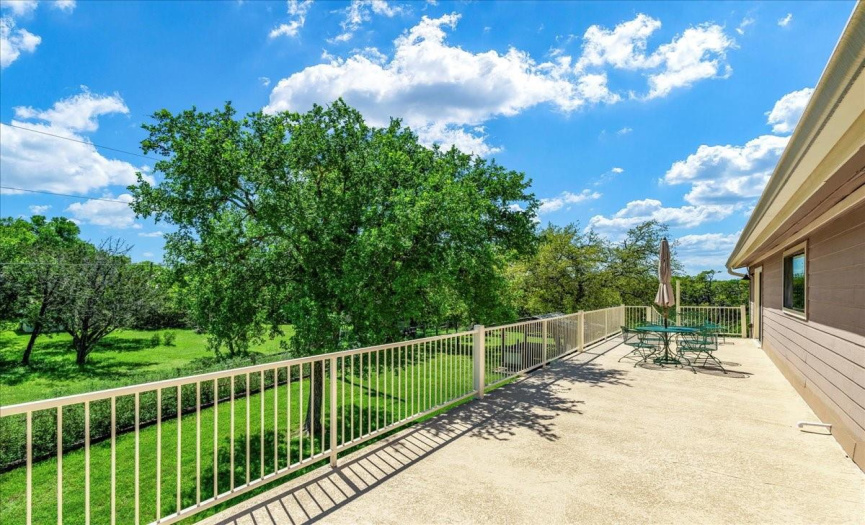 Take in breathtaking hill country views from the expansive second-floor terrace, offering a tranquil retreat to unwind and enjoy the scenery.