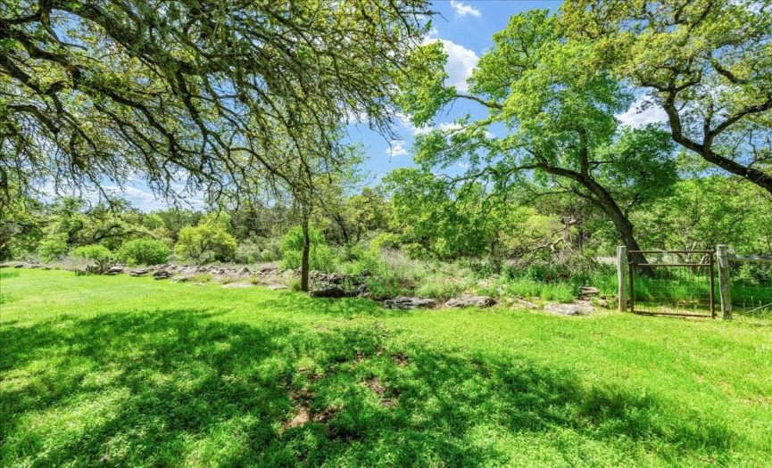 Uncover hidden treasures as you explore every corner of the fully fenced property, from the secluded nooks to the expansive hill country vistas, each offering its own unique charm and beauty.