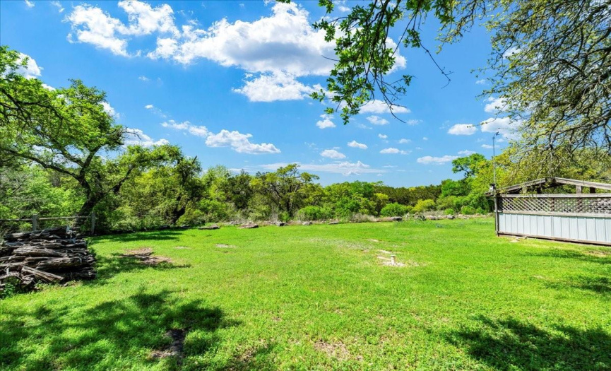 Escape the city hustle and embrace serene hill country living on this sprawling 1.889-acre property, offering unparalleled tranquility and privacy.
