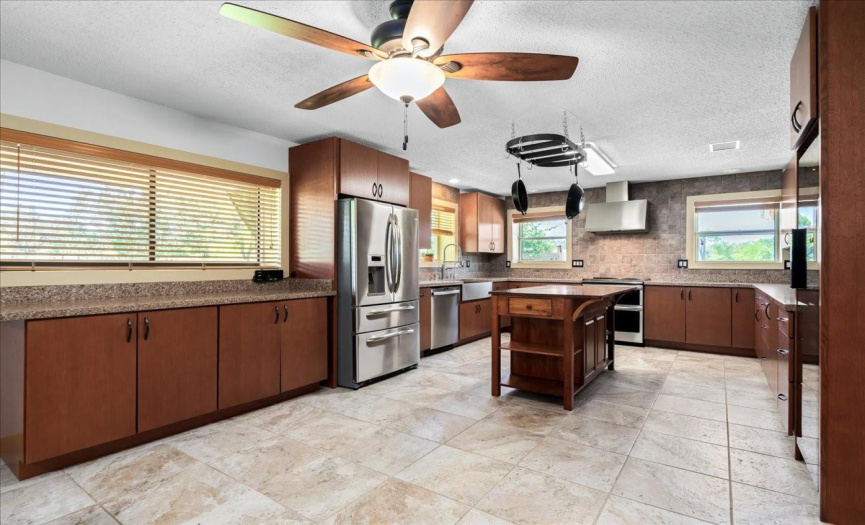 Experience culinary bliss in the updated eat-in kitchen, complete with high-end stainless-steel appliances.