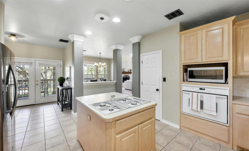 Bright and spacious, the kitchen offers ample counter space and storage.