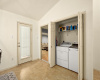 A convenient laundry closet tucked away in the kitchen, making household chores a breeze.