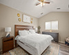 The primary bedroom offers great privacy and features a vaulted ceiling and a spacious walk-in closet.