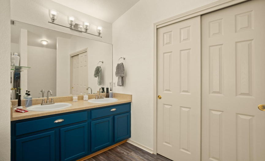 The primary en-suite bathroom is a luxurious retreat, complete with a dual vanity.