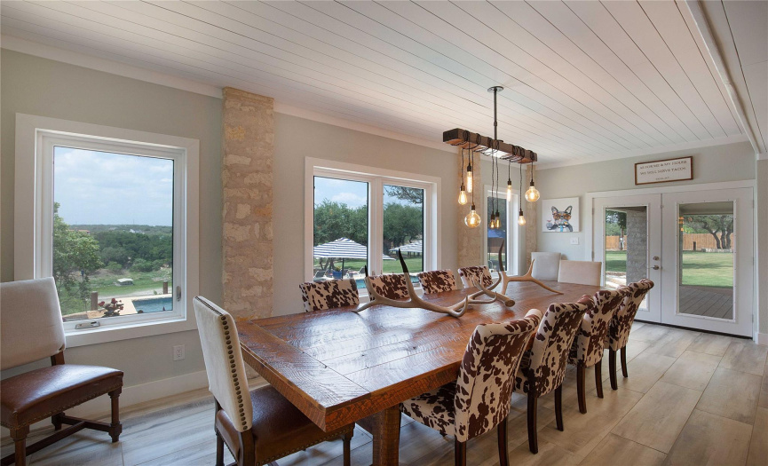 Enjoy meals with a view in the elegant dining room, offering panoramic vistas of the sprawling 3.44-acre property and the picturesque surroundings.