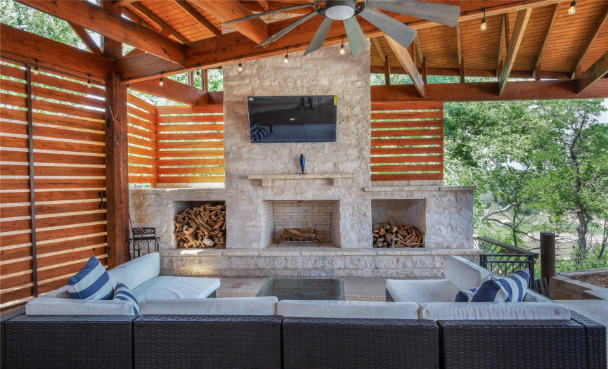 Escape to the cabana, a cozy retreat with a wood-burning fireplace, perfect for relaxing evenings under the stars or hosting intimate gatherings with loved ones.