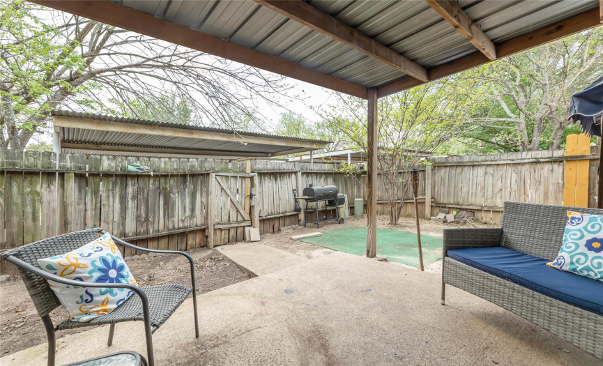 Fence yard with open space for a garden or furry friends!  Carport and locking storage shed are behind the fence 