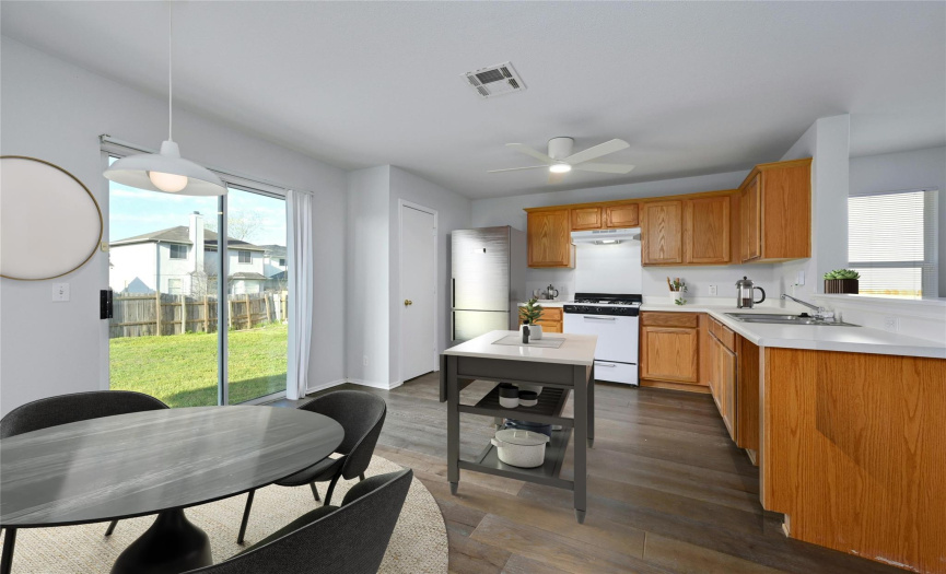 Well dimensioned kitchen can accommodate mobile island. Generous sized kitchen for gathering.