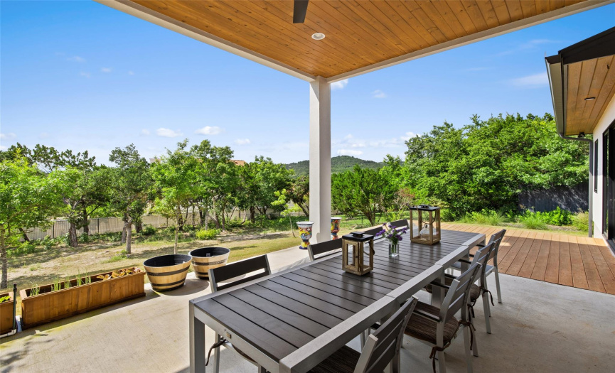 Main level outdoor patio equipped with outdoor kitchen and grill.