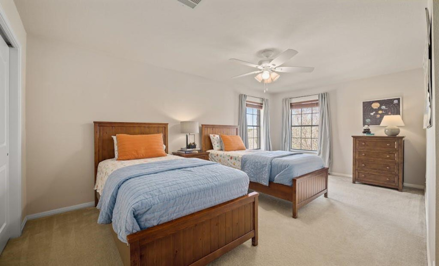 One of three large bedrooms upstairs, this one can easily be shared. 