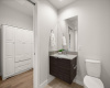 Indulge in luxury in the modern bathroom, featuring a sleek vanity and a spacious walk-in shower.