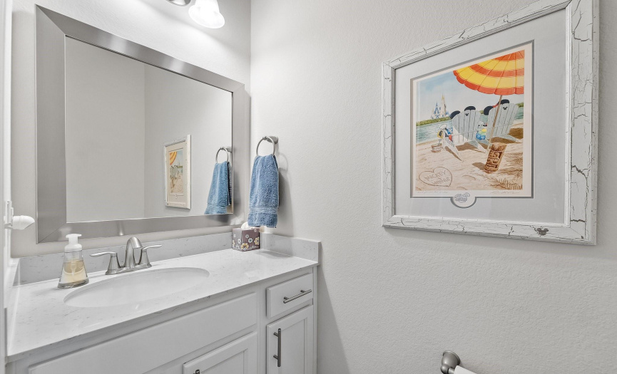 This strategically placed half bathroom offers both comfort and convenience, easily accessible by your guests.