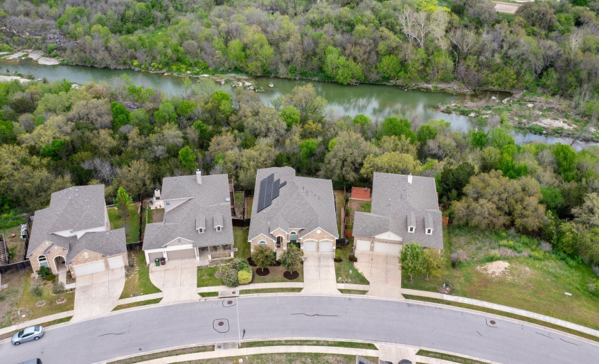 The aerial view reveals not just a home, but a sanctuary, where the boundaries between the man-made and the natural blur, creating a space that is as beautiful as it is tranquil.