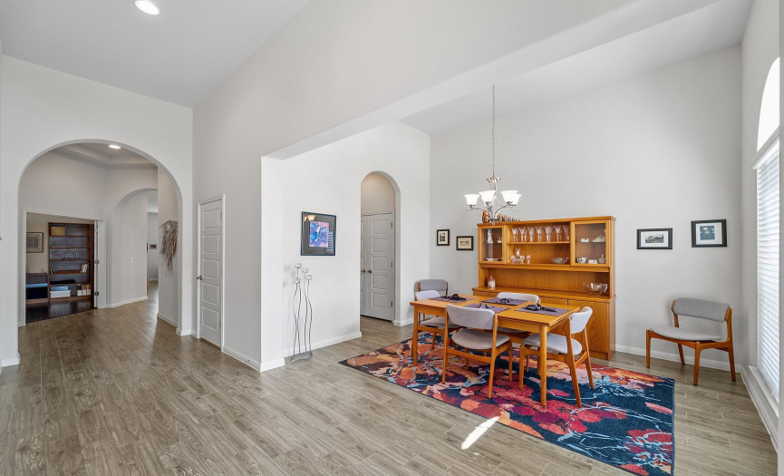 Sitting just down the hall from the kitchen, with its vast openness and strategic positioning, this area is tailor-made for entertaining guests and fostering memorable gatherings. 
