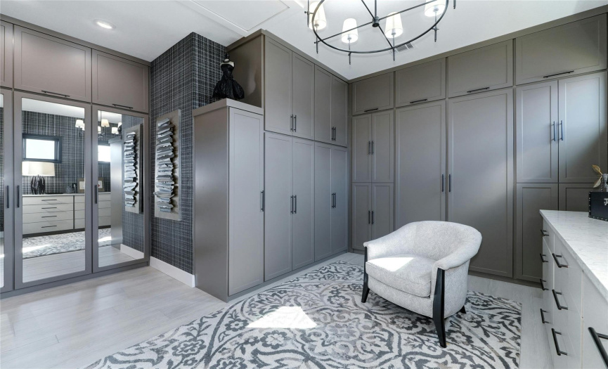 Master dressing area with natural light. All closet spaces are enclosed to minimize clutter. High closets have handles to lower upper hanging rods for easy access. 