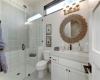 Ensuite bathroom 2 with natural light and large walk in shower with frameless glass enclosure.