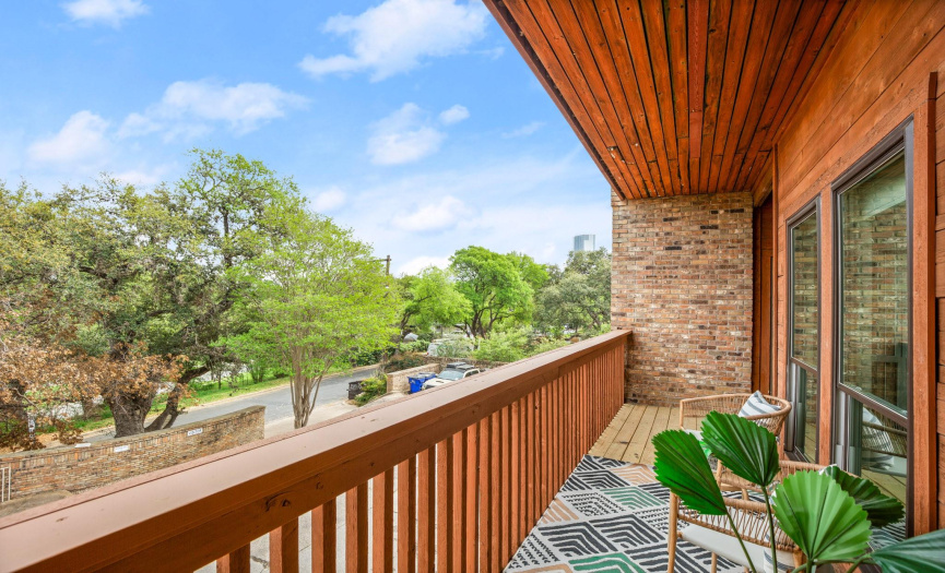 Enjoy relaxing and entertaining on the balcony with peek-a-boo views of the downtown skyline and the gorgeous tree-filled surrounding grounds. 