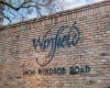 Winfield Condos residents enjoy a refreshing community pool and tree filled common grounds. 