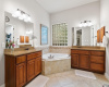 Step into the owners en-suite bathroom with dual vanities, garden tub, Walk-in shower.