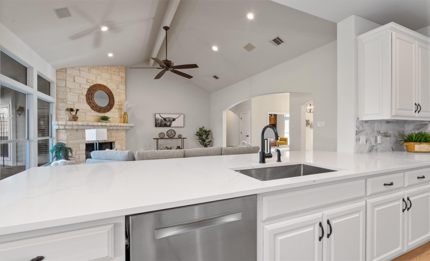 Culinary dreams come true in this state-of-the-art kitchen, boasting sleek countertops and top-of-the-line appliances. The open plan design integrates seamlessly with the living areas, inviting conversation and togetherness as you create your culinary masterpieces.
