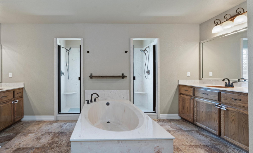 Luxurious master bath with island tub and dual entry shower.