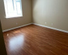 Large bedroom is ample for a double to queen size bed, nightstands, and dresser. 11.16'x11.77'