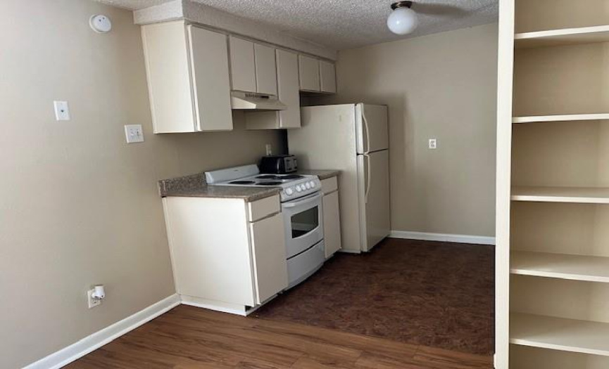 Kitchen is equipped with 4 burner electric stone, refrigerator, microwave and dishwasher.