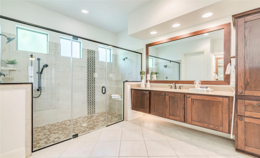 The BEST bathroom ever!  Oversized walk-in shower, two floating vanities, private water closet and terrific storage