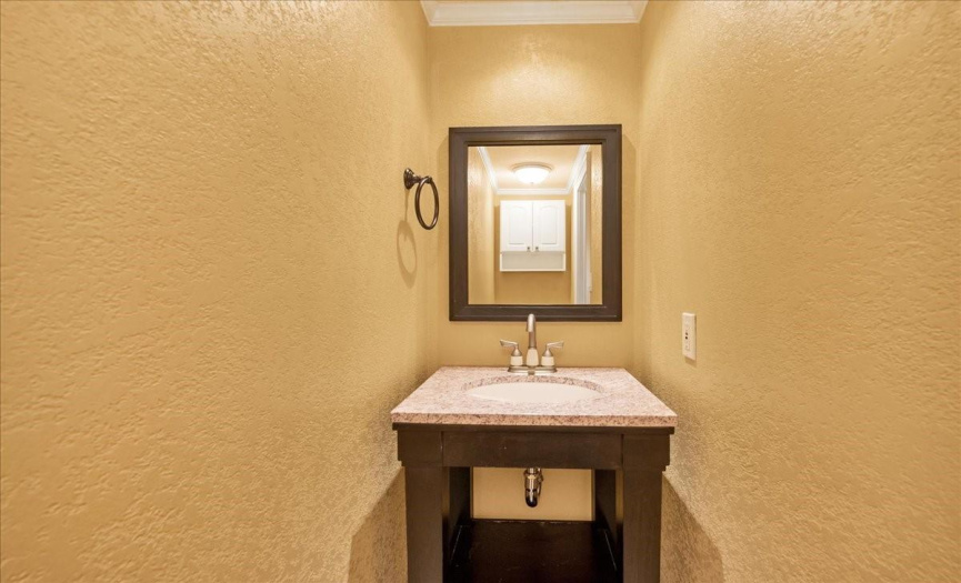 The half bath is for guests and is tucked away.  Don't miss it!