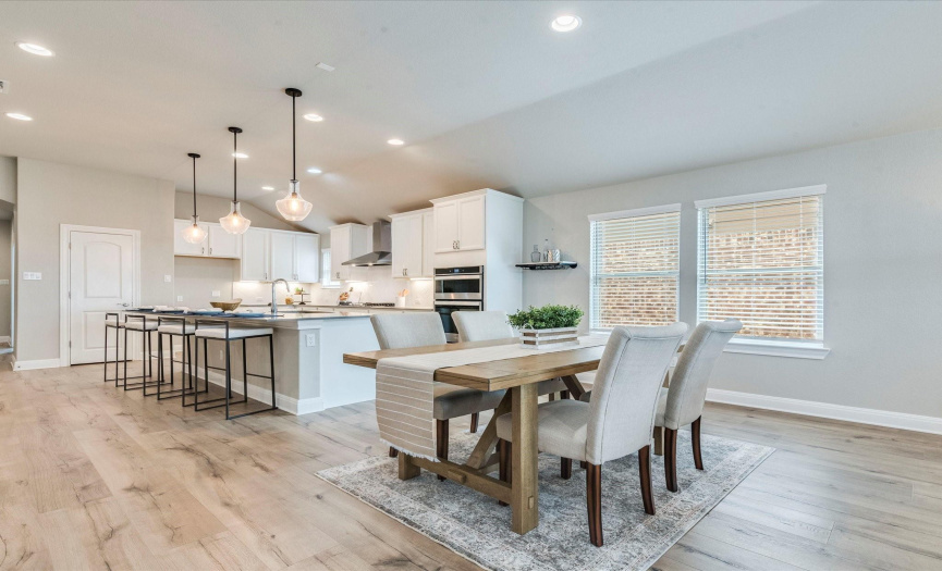The centrally located dining area provides plenty of space for a sizable dinign table where you can make lasting memories over home cooked meals. 