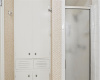 The primary ensuite also comes with a standing shower plus retro built-in linen storage. 