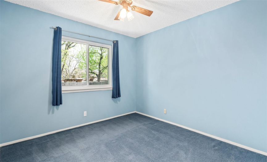 All of the secondary bedrooms provide ceiling fans and excellent closet storage. Updated flooring and neutral  paint would go a long way in these bedrooms. 