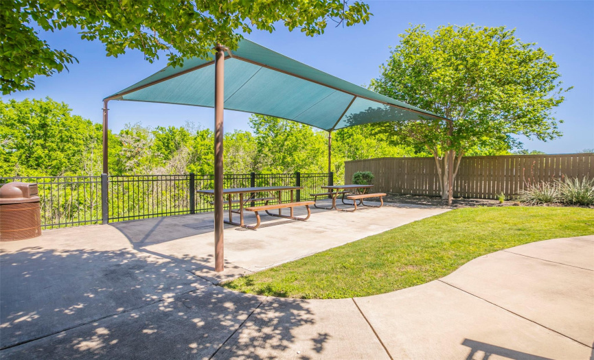 Just behind the playground is a nice covered picnic area that backs up to the park/greenbelt. Perfect for gathering with friends or your child's next birthday party! 
