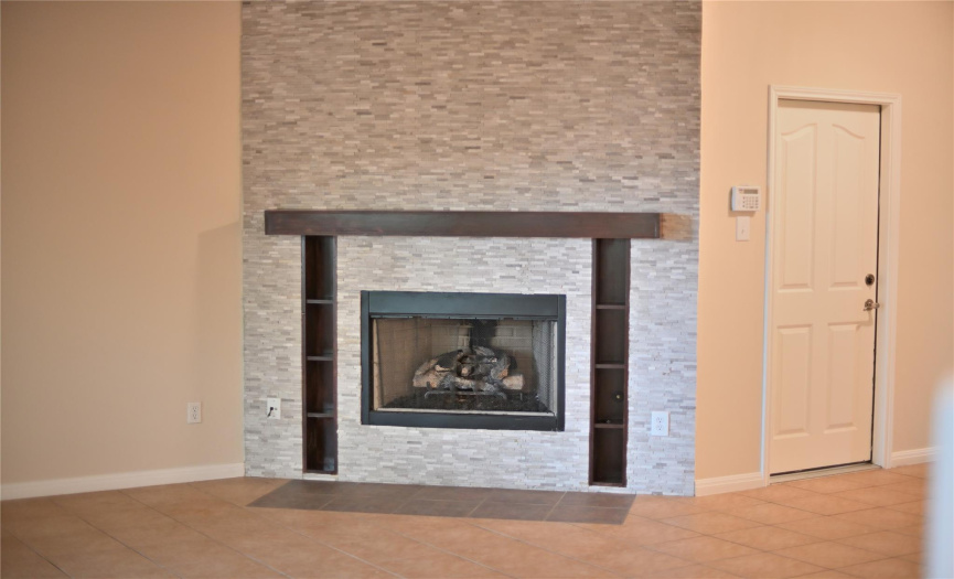 There are two fireplaces in the house, each adorned with beautiful logs, adding charm and warmth to the ambiance.