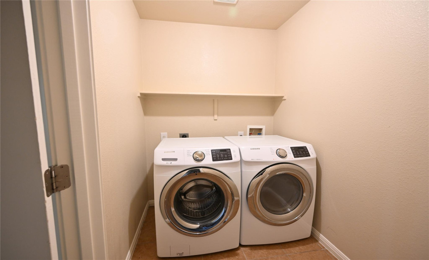 The laundry room is equipped with both electric and gas connections for your dryer, offering flexibility to accommodate your preferences. washer/dryer convey.