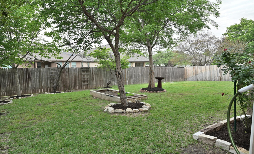 Impressive backyard withplanty of trees and space for your pets