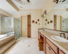 The primary bath is super-sized with double vanities, a garden tub and separate shower.
